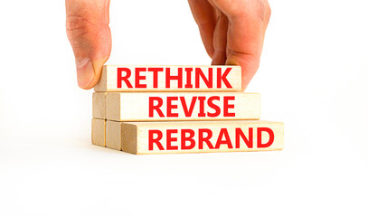 Rethink revise rebrand symbol. Concept word Rethink Revise Rebrand on beautiful block. Beautiful white table white background. Business brand motivational rethink revise rebrand concept. Copy space.