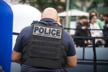 Strasbourg -France - 29 August 2023 - Portrait on back view of french police man standing in the...