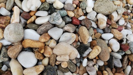 Pebbles in bright colors on the beach