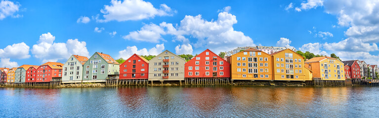 Panoramic view of old colorful wooden houses over the Nidelva river in Trondheim, Norway - 646096833