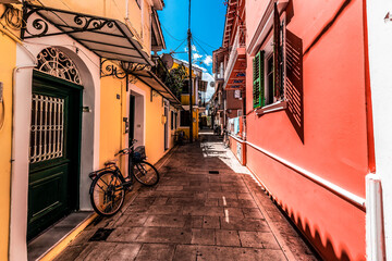 Colourful Lefkada street with yellow and pink buildings