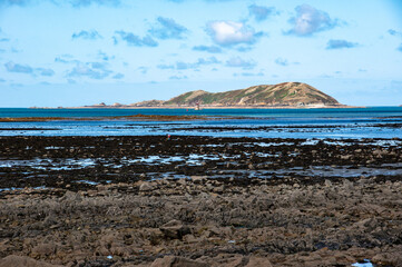 Scenic View of the Sea and Tomé Island from the Coast in Louannec, Brittany, France