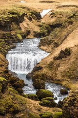 Steinbogafoss waterfall in its beautiful canyon created by the waters of Skóga river, Laugavegur hiking trail, Iceland