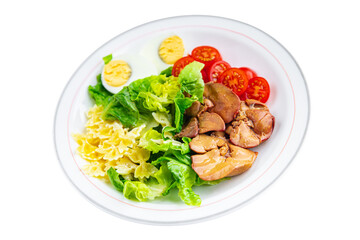 salad chicken liver, pasta salad , tomato, green leaf lettuce, boiled egg, farfalle snack meal food on the table copy space food background rustic top view