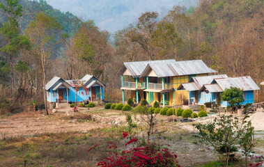 Cluster of wooden houses at Railey river valley surrounded with mountain at Kalimpong district in West Bengal, India