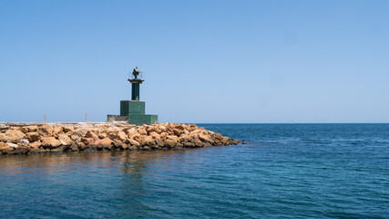 View of a lighthouse on the Mediterranean Sea, view from the boat.