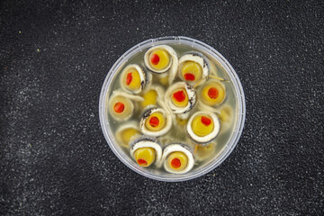 olive in anchovy fillet, anchovys roll stuffed olives apetizing seafood fish marinated appetizer meal food snack on the table copy space food background rustic top