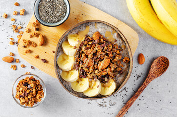 Chia Pudding Bowl with Banana, Granola and Cinnamon, Healthy Breakfast, Vegetarian Food