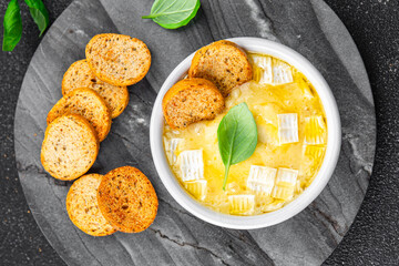 brie baked cheese or camembert tartiflette soft cheese meal food snack on the table copy space food background rustic top view
