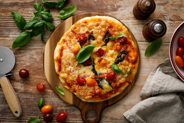 Pizza Margherita on a wooden background