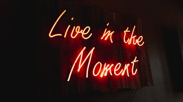Live in the moment sign at restaurant