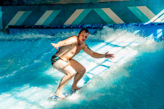 Man on flowboard on blue background