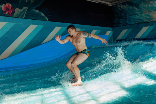 Man on flowboard on blue background