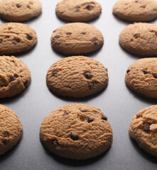 Mini chocolate chip cookies on baking sheet