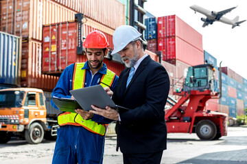 Foreman or worker work at Container cargo site check up goods in container. Foreman or worker checking on shipping containers. Logistics and shipping..