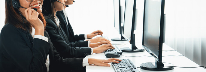 Business people wearing headset working in office to support remote customer or colleague. Call...