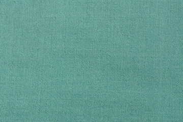 Solid green material made from natural wool. Background