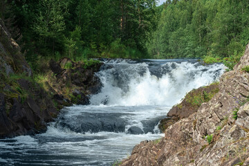 natural landscape with a clear waterfall on a forest river
