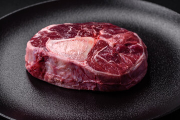 Fresh beef ossobuco steak with salt, spices and herbs