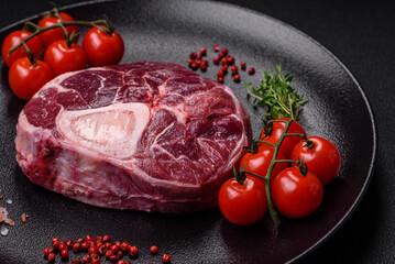 Fresh beef ossobuco steak with salt, spices and herbs