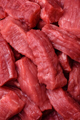 Raw organic meat beef or lamb cut into slices with salt, spices and herbs