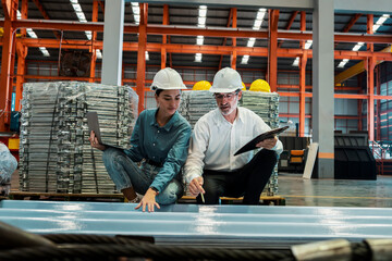 Metalwork manufacturing factory manager inspect newly manufactured metal or steel sheets and frame...