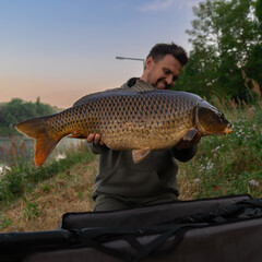 men hold fish, carp, carpfishing