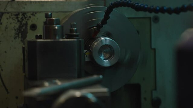 The CNC lathe machine thread cutting at the end of metal cone shape parts. The hi-technology metal working processing by CNC turning machine