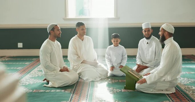 Muslim, teaching and people in mosque for praying, religious education and worship or prayer. Islamic community, religion and men talking on carpet for Ramadan Kareem, learning Quran and Eid Mubarak