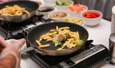 Sizzling culinary artistry in a hot frypan, epitomizing the joy and creativity of home cooking