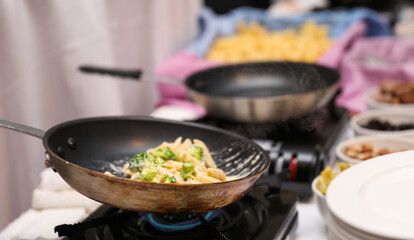 Sizzling culinary artistry in a hot frypan, epitomizing the joy and creativity of home cooking