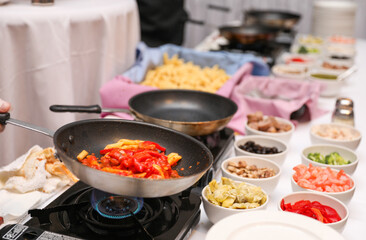 Sizzling culinary artistry in a hot frypan, epitomizing the joy and creativity of home cooking