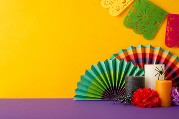 Set mood with side view shot of purple table decked out in Mexican Day of the Dead theme. Vivid...