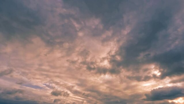timelapse of the sky of massive gray snow or rain clouds at sundown