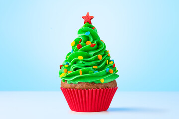 Cupcake. Christmas Tree cupcake with star on top. Red cup liners. Merry Christmas. Tasty baking...