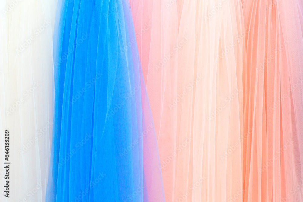 Poster mix colorful hanging vertical stripe textile, fabrics, cloths on the rack. texture of multicolored f
