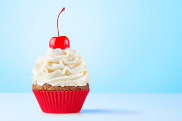 Cupcake. Birthday cupcake with cherry on top. Red cup liners. Happy Birthday. Tasty baking...