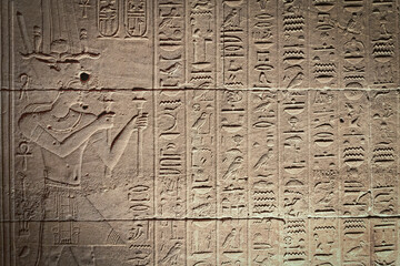 Old Egyptian hieroglyphs on an ancient background. Horizontally.  - obrazy, fototapety, plakaty