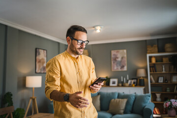 One adult man with eyeglasses at home use mobile phone have problem