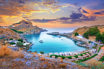 Panoramic view of St. Paul bay with acropolis of Lindos in background, Rhodes island, Greece - 646141220