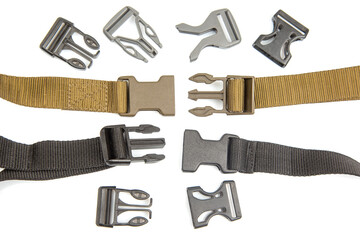 Fastex plastic clip for backpacks, bags, nylon belts on a white background. items and accessories for clothing and fixing tourist equipment