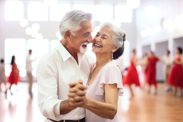 An older couple dance happily and having fun at a dance class