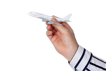 A man's hand in a white shirt holds in his hand a model of a passenger airliner.