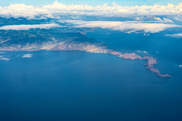 Aerial view of the ocean, the southeast coastline of Madeira Island and the foothills of the Sao Lourenco coastal cliffs. Day shot, Madeira, Portugal, Europe.