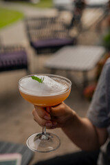 Breezy white foam cocktail with peppermint at cocktail bar