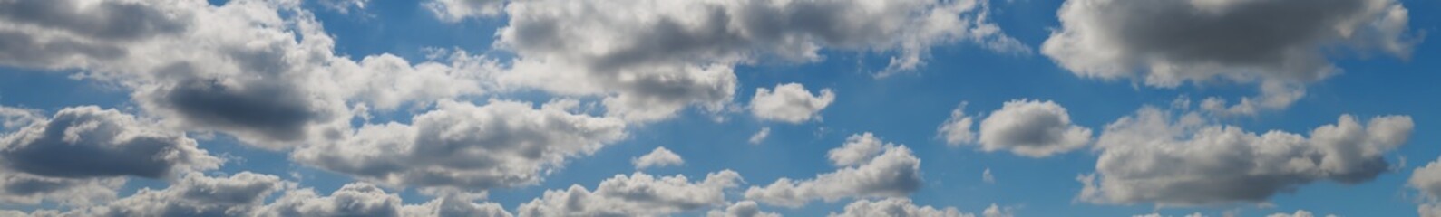 white and gray clouds in the blue sky, layered rain clouds, stratocumulus, cumulonimbus,...