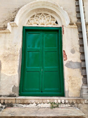 Fototapeta na wymiar Antique Indian style Wooden Door at Ramnagar fort varanasi India. Mughal architecture