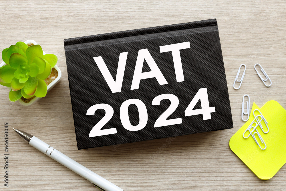 Poster vat 2024 text in white font on a black notepad on the table
