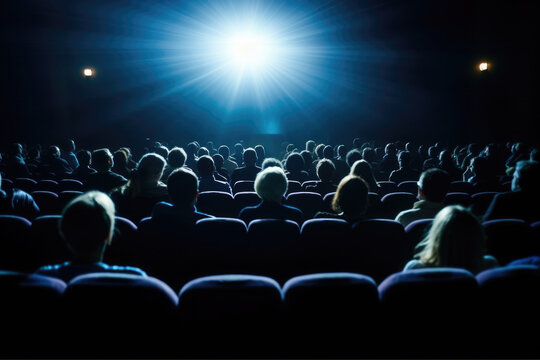 Crowd of people gathered in theater, engrossed in watching movie. This image can be used to depict experience of watching film in cinema setting.