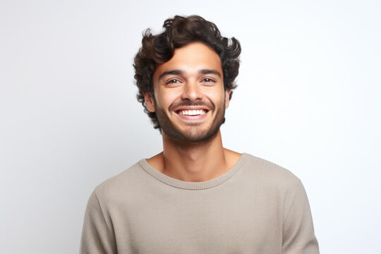 Picture of man with curly hair and friendly smile. Perfect for portraying positivity and approachability. Ideal for use in advertisements, websites, or social media campaigns.